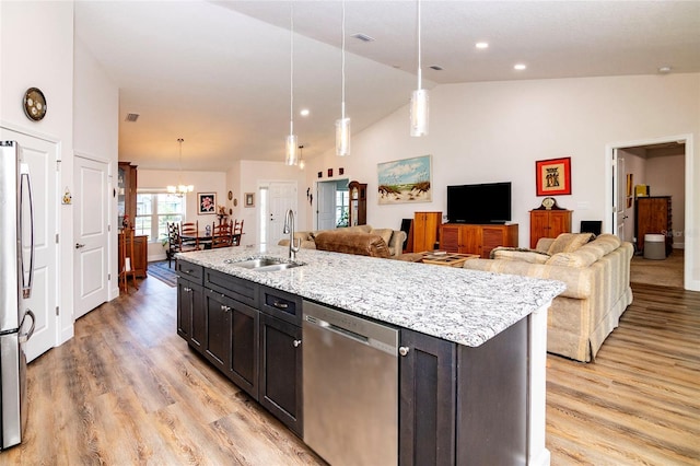 15 Raleigh Dr, Palm Coast, FL 32164 - kitchen featuring appliances with stainless steel finishes, light wood-type flooring, open floor plan, high vaulted ceiling, and recessed lighting