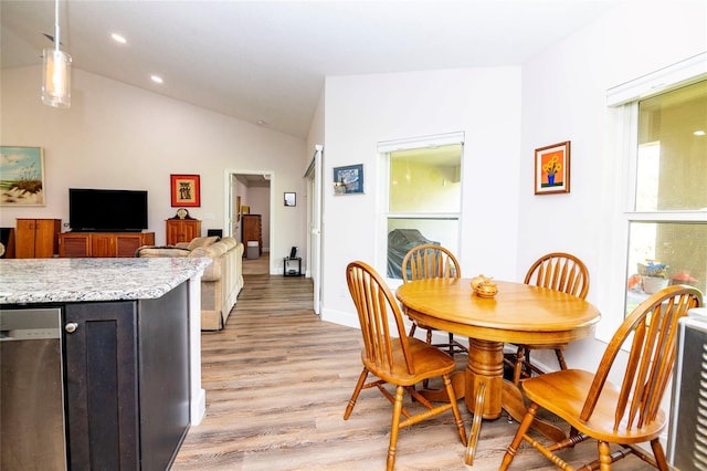 15 Raleigh Dr, Palm Coast, FL 32164 - dining space featuring light wood-style flooring, lofted ceiling, and recessed lighting