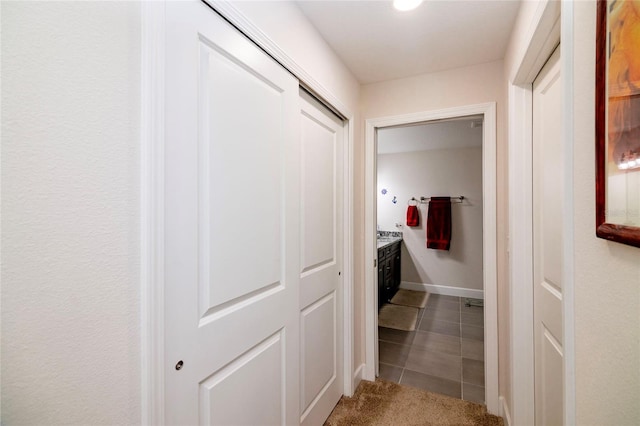 15 Raleigh Dr, Palm Coast, FL 32164 - hall with tile patterned flooring and carpet