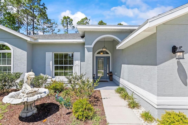 9 Port Royal Dr, Palm Coast, FL 32164 - doorway to property featuring stucco siding