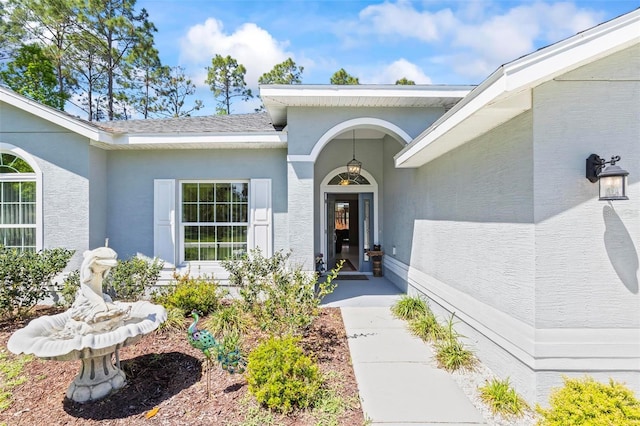 9 Port Royal Dr, Palm Coast, FL 32164 - doorway to property with stucco siding
