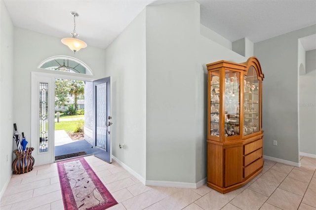 9 Port Royal Dr, Palm Coast, FL 32164 - foyer with high vaulted ceiling and light tile patterned floors