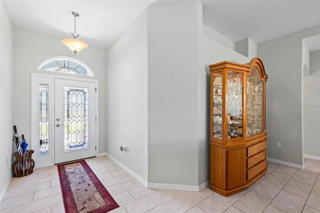 9 Port Royal Dr, Palm Coast, FL 32164 - foyer entrance featuring lofted ceiling and light tile patterned floors