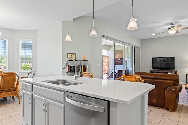 9 Port Royal Dr, Palm Coast, FL 32164 - kitchen with stainless steel dishwasher, open floor plan, light tile patterned floors, light countertops, and decorative light fixtures