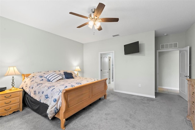 9 Port Royal Dr, Palm Coast, FL 32164 - carpeted bedroom with baseboards and ceiling fan