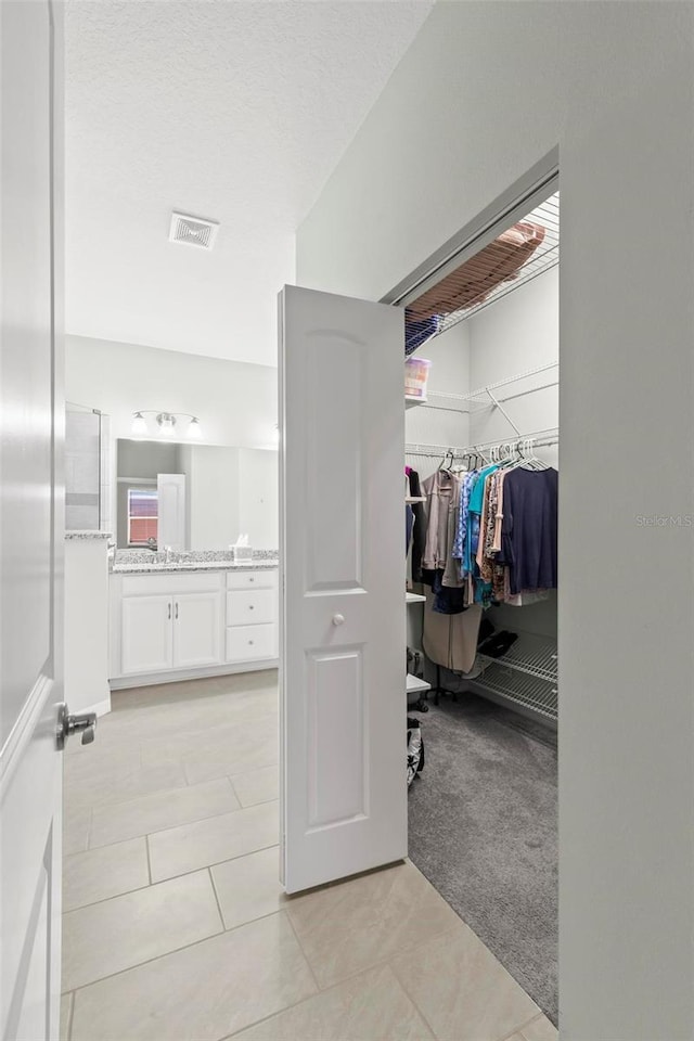 9 Port Royal Dr, Palm Coast, FL 32164 - hall featuring light tile patterned floors