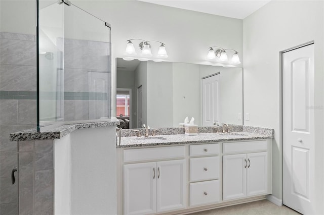 9 Port Royal Dr, Palm Coast, FL 32164 - bathroom featuring double vanity and tiled shower