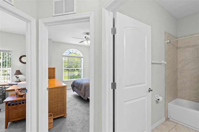 9 Port Royal Dr, Palm Coast, FL 32164 - ensuite bathroom with tub / shower combination and a ceiling fan
