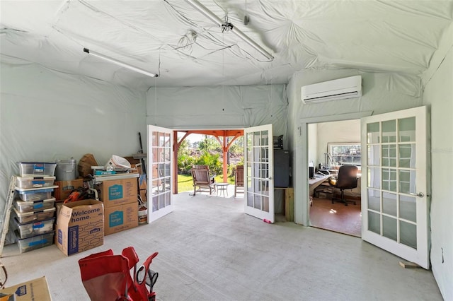 9 Port Royal Dr, Palm Coast, FL 32164 - garage with a wall unit AC, an office area, and french doors