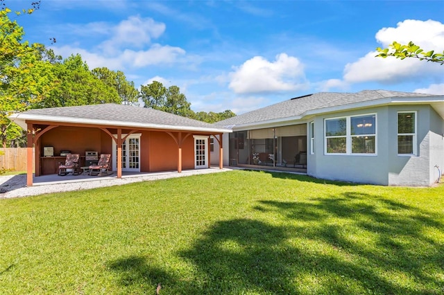 9 Port Royal Dr, Palm Coast, FL 32164 - back of house featuring french doors, stucco siding, a sunroom, and a patio area