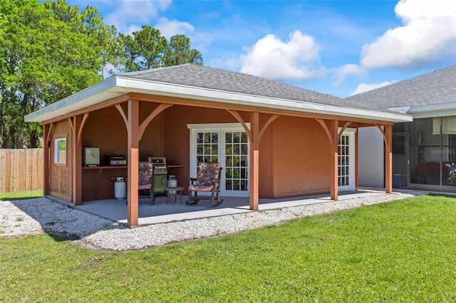 9 Port Royal Dr, Palm Coast, FL 32164 - back of house featuring a patio area, a shingled roof, and stucco siding