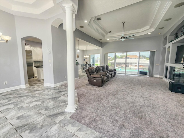 101 Covington Ln, Palm Coast, FL 32137 - living area with a raised ceiling, a ceiling fan, a high ceiling, crown molding, and baseboards