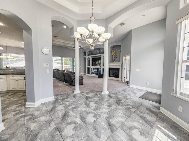 101 Covington Ln, Palm Coast, FL 32137 - unfurnished living room with a chandelier, marble finish flooring, baseboards, a raised ceiling, and recessed lighting