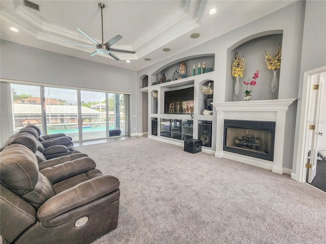 101 Covington Ln, Palm Coast, FL 32137 - living area featuring built in shelves, ceiling fan, carpet flooring, a fireplace, and recessed lighting