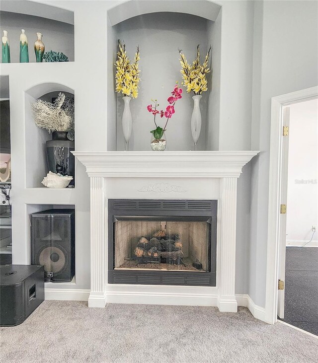101 Covington Ln, Palm Coast, FL 32137 - detailed view of a fireplace, carpet floors, and baseboards