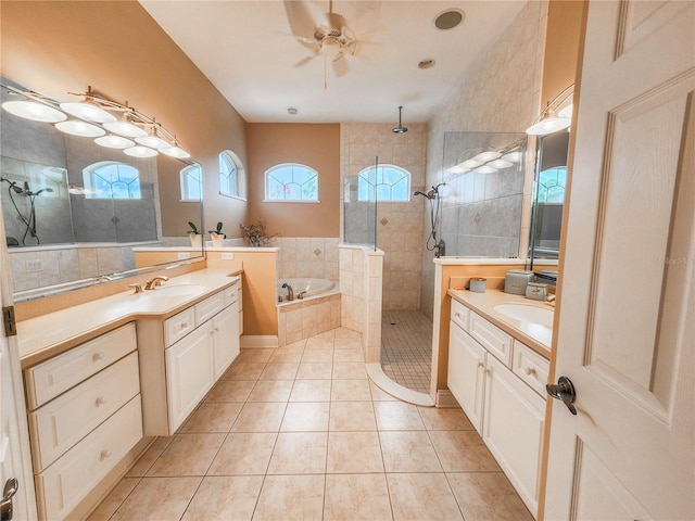 101 Covington Ln, Palm Coast, FL 32137 - bathroom featuring two vanities, a bath, tiled shower, and tile patterned floors