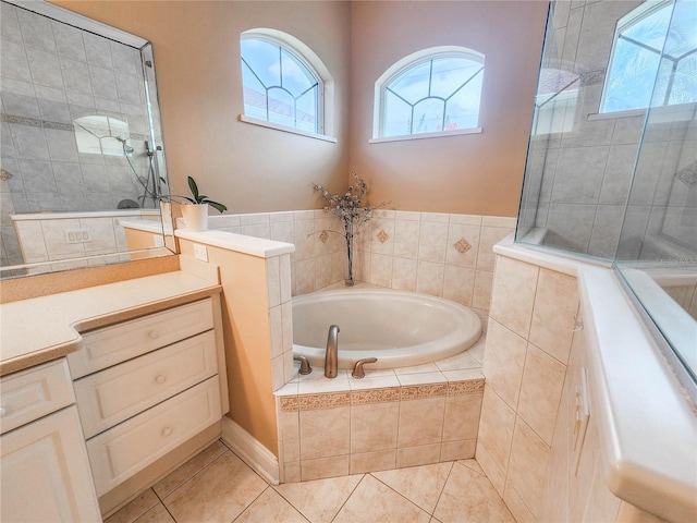101 Covington Ln, Palm Coast, FL 32137 - full bath with vanity, healthy amount of natural light, a garden tub, and tile patterned flooring
