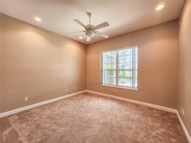 101 Covington Ln, Palm Coast, FL 32137 - spare room with carpet, baseboards, a ceiling fan, recessed lighting, and a textured ceiling