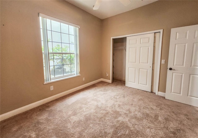 101 Covington Ln, Palm Coast, FL 32137 - unfurnished bedroom featuring carpet, a closet, baseboards, and ceiling fan