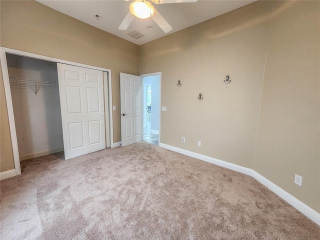 101 Covington Ln, Palm Coast, FL 32137 - unfurnished bedroom featuring carpet floors, baseboards, a closet, and a ceiling fan