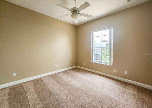 101 Covington Ln, Palm Coast, FL 32137 - spare room with ceiling fan, baseboards, and light colored carpet