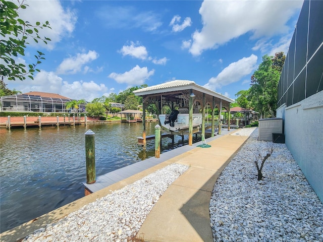 101 Covington Ln, Palm Coast, FL 32137 - dock area featuring boat lift, a water view, and glass enclosure