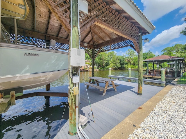 101 Covington Ln, Palm Coast, FL 32137 - dock with boat lift, a gazebo, and a water view