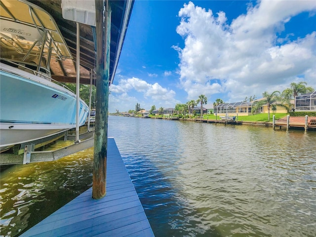101 Covington Ln, Palm Coast, FL 32137 - dock area with a water view, boat lift, and a residential view