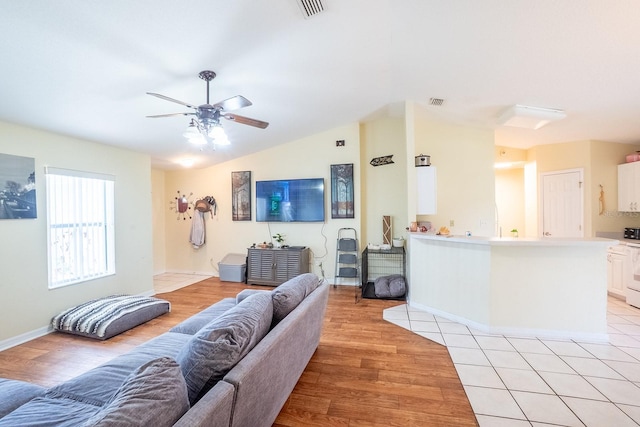 19 Rydell Ln, Palm Coast, FL 32164 - living room featuring ceiling fan, light wood-style floors, and lofted ceiling