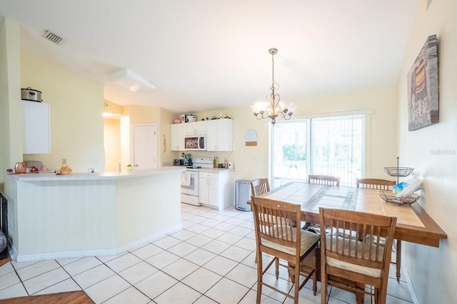19 Rydell Ln, Palm Coast, FL 32164 - dining area with a chandelier and light tile patterned floors