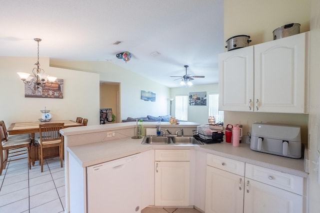 19 Rydell Ln, Palm Coast, FL 32164 - kitchen with white dishwasher, a peninsula, a chandelier, vaulted ceiling, and a ceiling fan
