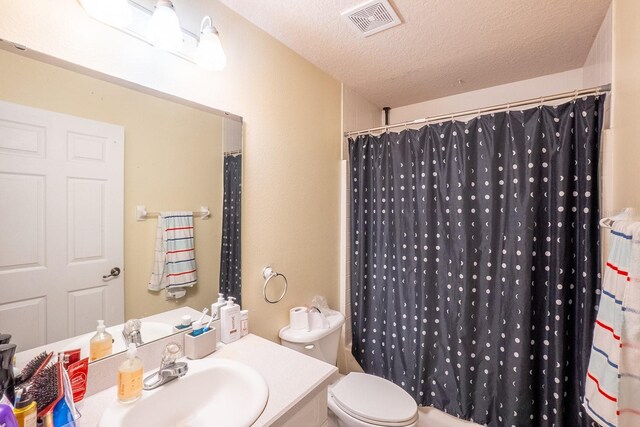 19 Rydell Ln, Palm Coast, FL 32164 - full bathroom featuring vanity, a textured ceiling, and a shower with shower curtain