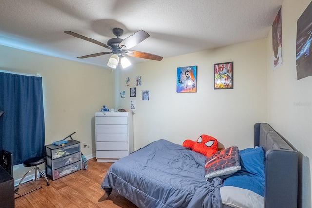 19 Rydell Ln, Palm Coast, FL 32164 - bedroom featuring light wood-type flooring, a textured ceiling, and ceiling fan