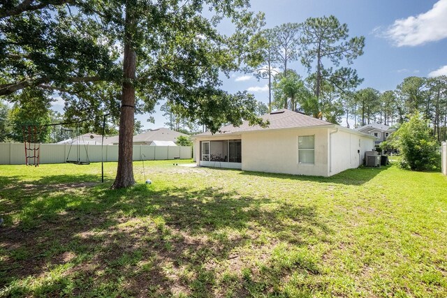 19 Rydell Ln, Palm Coast, FL 32164 - view of yard featuring a sunroom