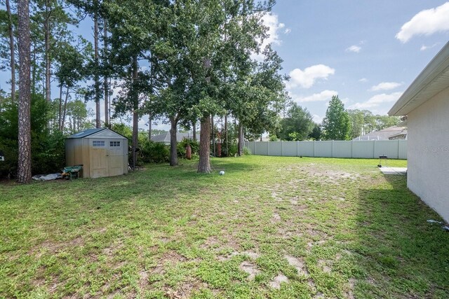 19 Rydell Ln, Palm Coast, FL 32164 - view of yard with a storage unit