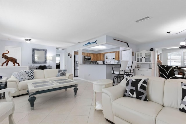 12 Fernwood Ln, Palm Coast, FL 32137 - living room with light tile patterned floors