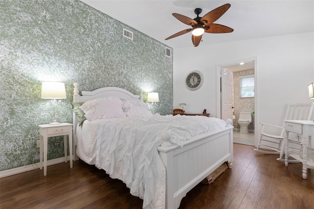 12 Fernwood Ln, Palm Coast, FL 32137 - bedroom with wallpapered walls, an accent wall, wood finished floors, ensuite bathroom, and ceiling fan