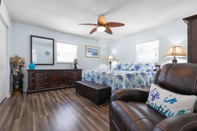 12 Fernwood Ln, Palm Coast, FL 32137 - bedroom featuring multiple windows, dark wood-style floors, a textured ceiling, and a ceiling fan