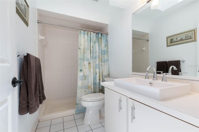 12 Fernwood Ln, Palm Coast, FL 32137 - bathroom featuring tile patterned flooring, vanity, and tiled shower