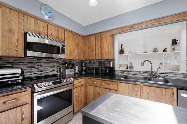 12 Fernwood Ln, Palm Coast, FL 32137 - kitchen featuring appliances with stainless steel finishes, tasteful backsplash, brown cabinetry, and light tile patterned floors