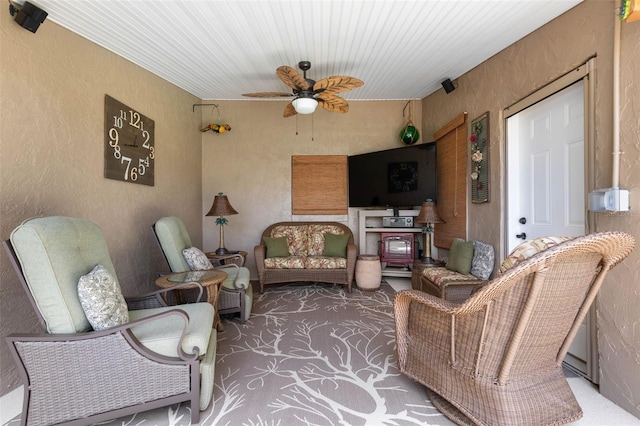 12 Fernwood Ln, Palm Coast, FL 32137 - carpeted living room featuring a ceiling fan and a textured wall