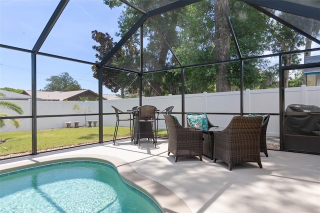 12 Fernwood Ln, Palm Coast, FL 32137 - view of swimming pool with a fenced backyard, a patio area, outdoor dining space, and glass enclosure