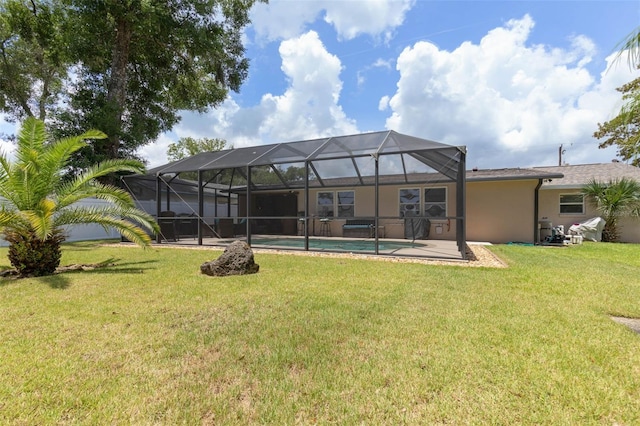 12 Fernwood Ln, Palm Coast, FL 32137 - rear view of property featuring a lawn, stucco siding, an outdoor pool, and glass enclosure