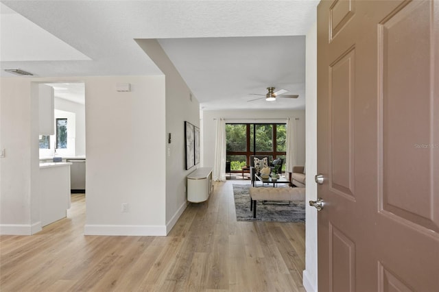 7 Sherbury Ct Unit 7, Palm Coast, FL 32137 - entrance foyer featuring a ceiling fan, light wood finished floors, and baseboards