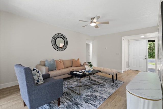 7 Sherbury Ct Unit 7, Palm Coast, FL 32137 - living room with a ceiling fan, light wood-style floors, and baseboards