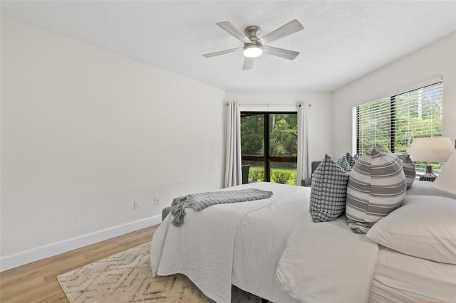 7 Sherbury Ct Unit 7, Palm Coast, FL 32137 - bedroom featuring wood finished floors, baseboards, and a ceiling fan