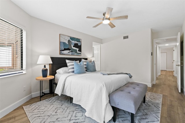 7 Sherbury Ct Unit 7, Palm Coast, FL 32137 - bedroom featuring wood finished floors, baseboards, and a ceiling fan