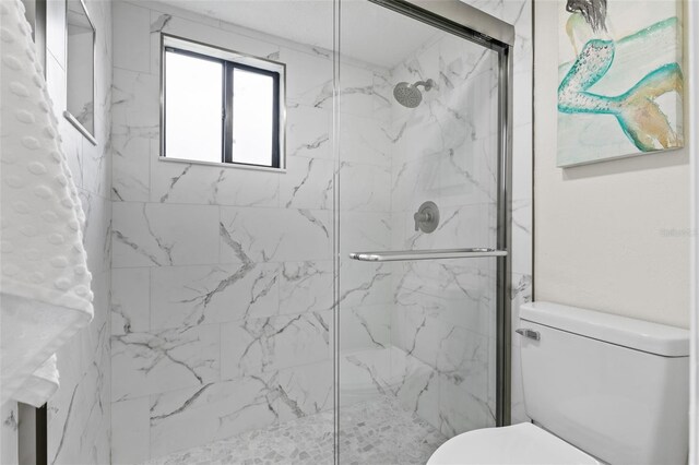 7 Sherbury Ct Unit 7, Palm Coast, FL 32137 - bathroom with toilet and a marble finish shower