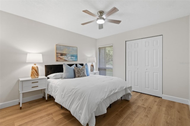 7 Sherbury Ct Unit 7, Palm Coast, FL 32137 - bedroom with baseboards, light wood-style floors, a closet, and ceiling fan