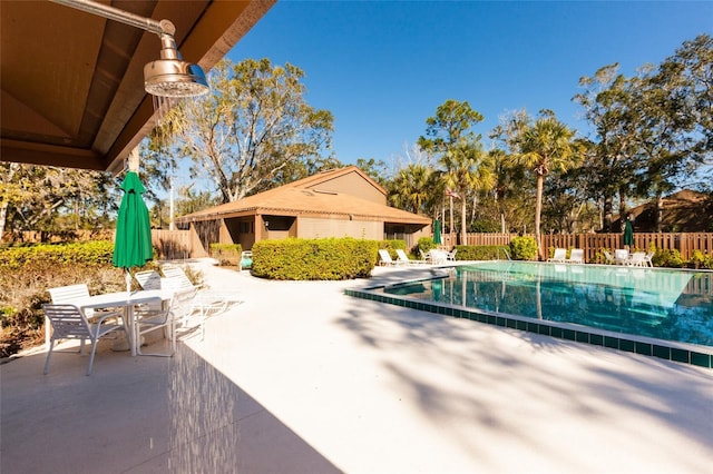 7 Sherbury Ct Unit 7, Palm Coast, FL 32137 - community pool with a patio area and outdoor dining area